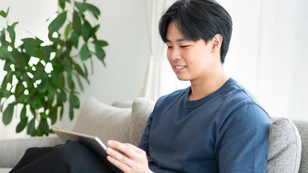 Watching an online session on a tablet at home
